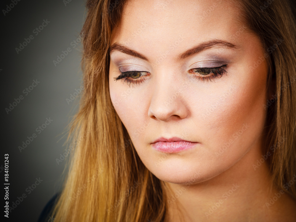 Portrait blonde young woman having serious face expression Portrait blonde young woman having serious face expression