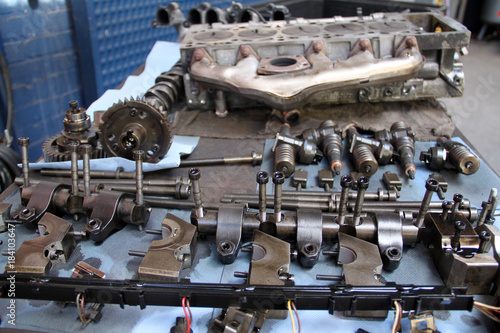 Disassembled five-cylinder car engine for repair in garage
