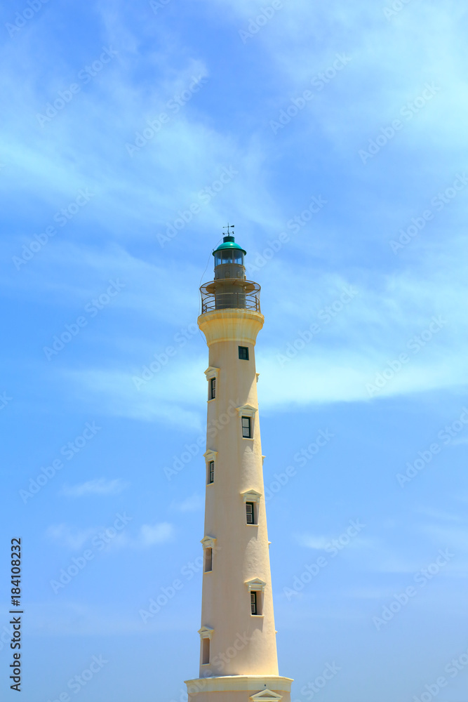 California Lighthouse on blue sky background isolated, Aruba coastline. Nice landscape background. California Lighthouse on blue sky background isolated, Aruba coastline. Nice landscape background.