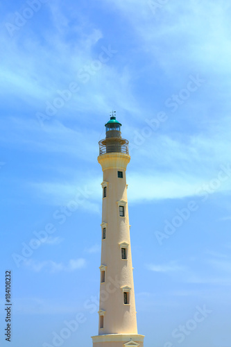 California Lighthouse on blue sky background isolated, Aruba coastline. Nice landscape background.