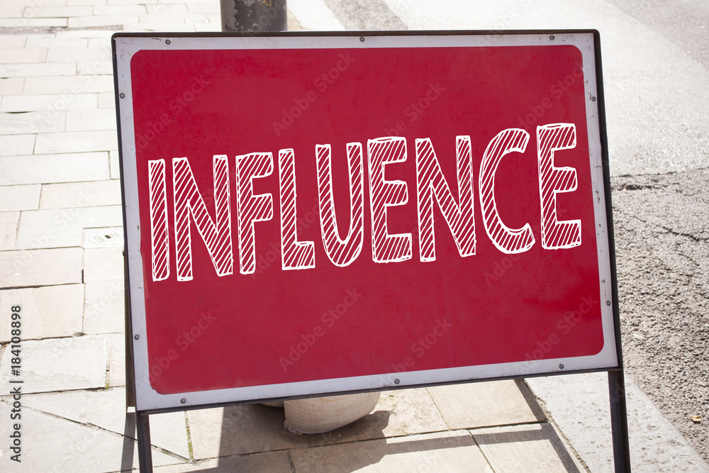 Obraz premium Conceptual hand writing text caption inspiration showing Influence. Business concept for Business Analysis and Strategy written on announcement road sign with background and copy space