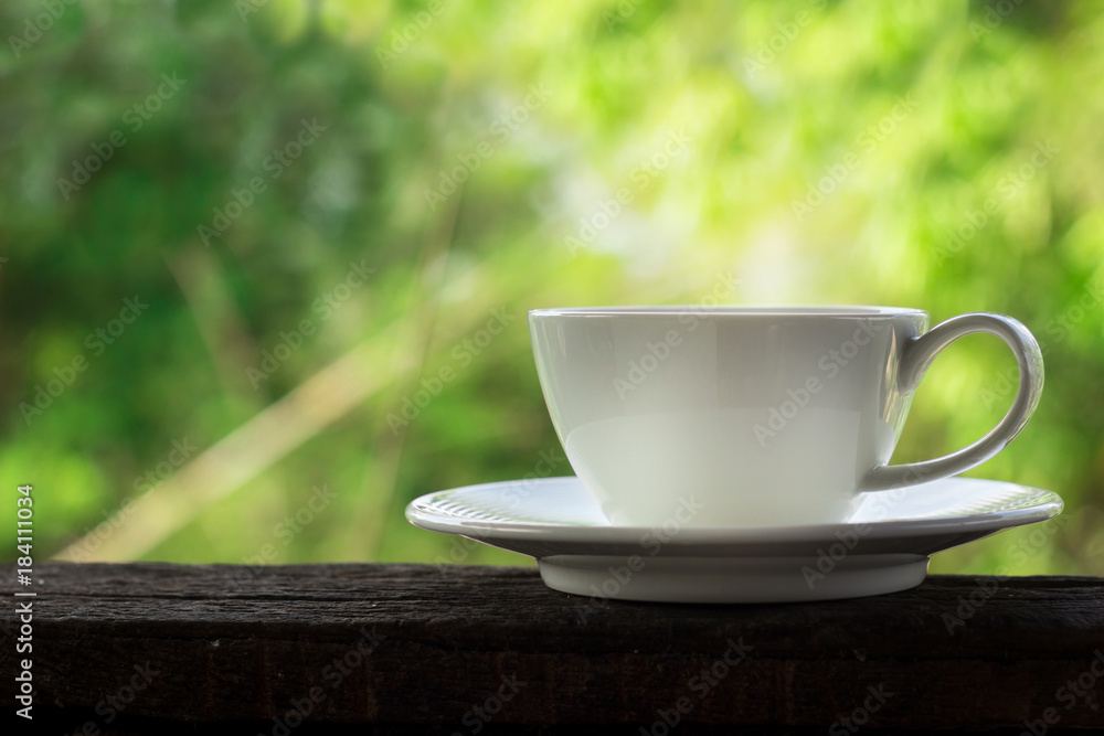 white coffee cup with green bokeh background white coffee cup with green bokeh background