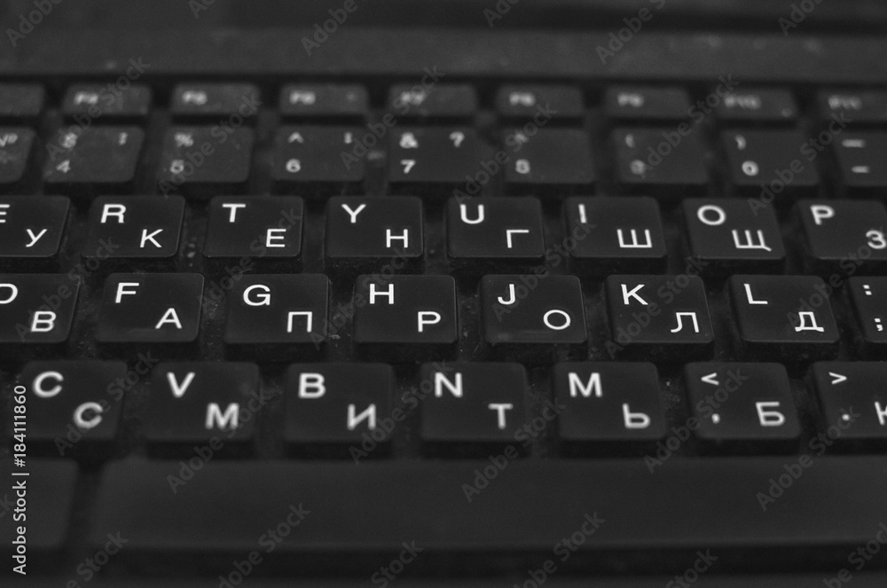 black keyboard with Russian and English letters
