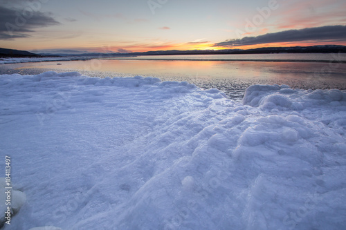 sunset over Deer Lake Icy shore © David
