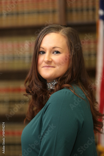 Portrait of a young attractive woman, woman lawyer in law library