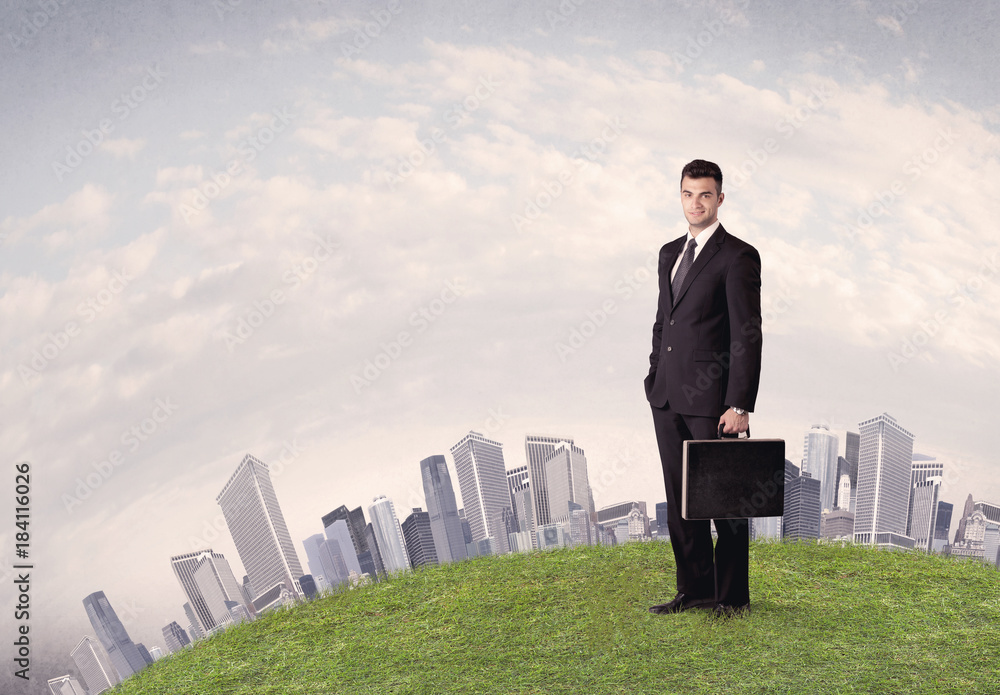 man standing in front of city landscape man standing in front of city landscape