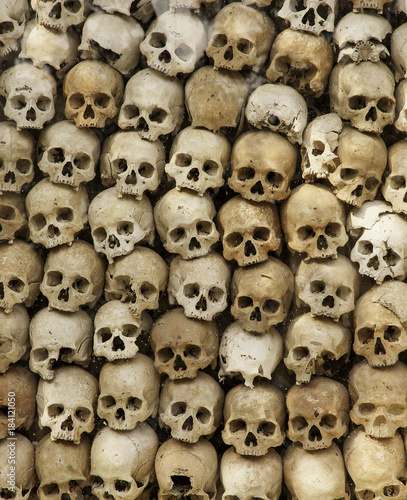 Cambodian killing field, shrine, skulls from victims showing horrific genocide