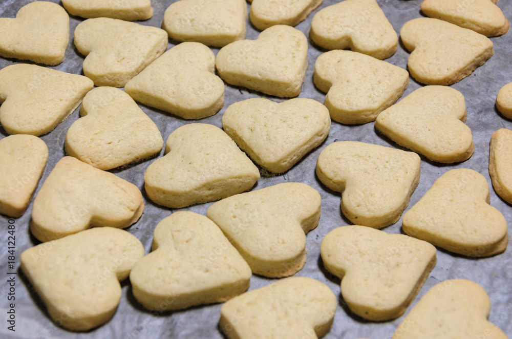 raw cookies in the shape of hearts, top view.