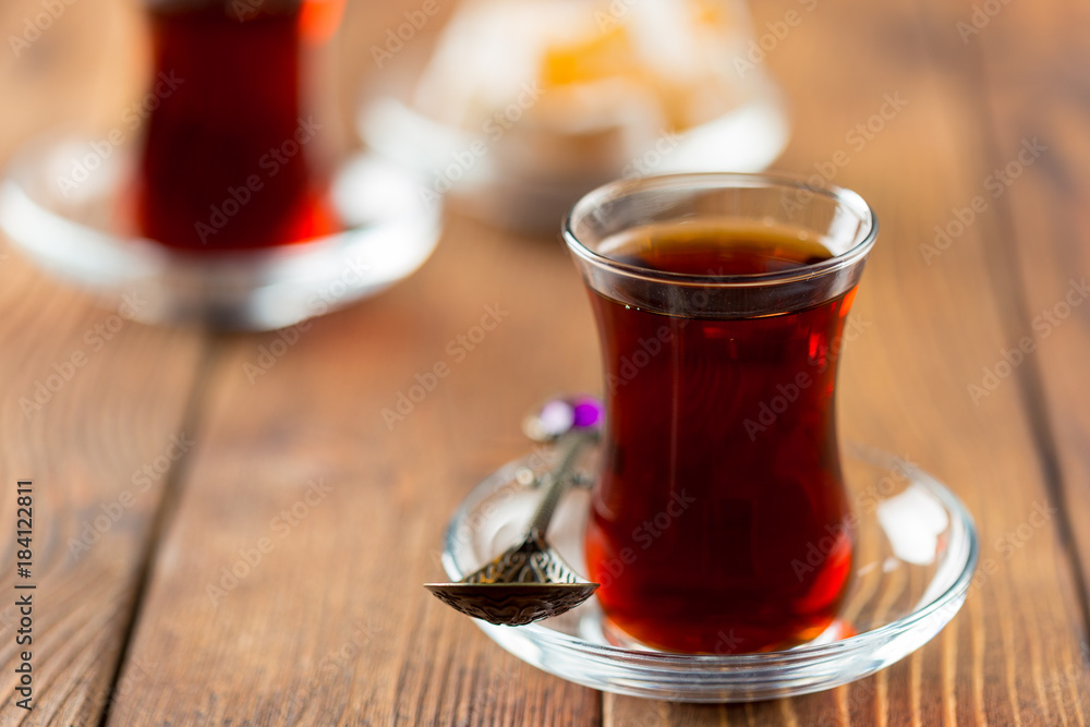 Red tea in turkish glasses on a wooden table Red tea in turkish glasses on a wooden table