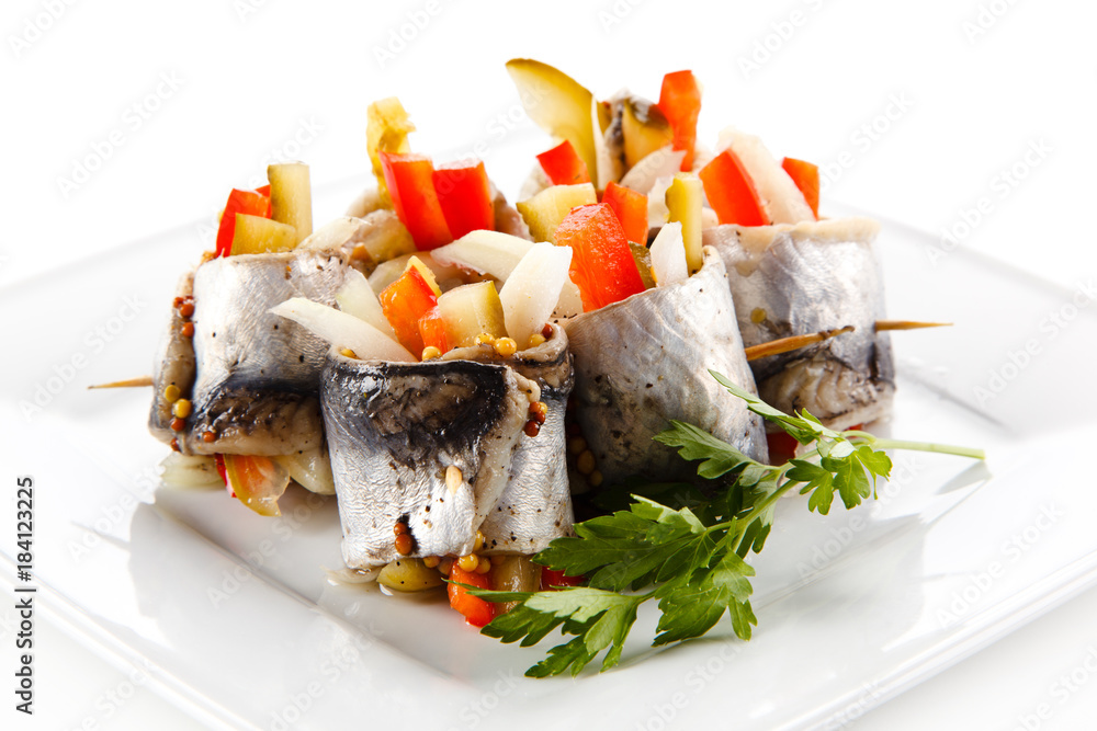 Marinated herring fillets on white background Marinated herring fillets on white background