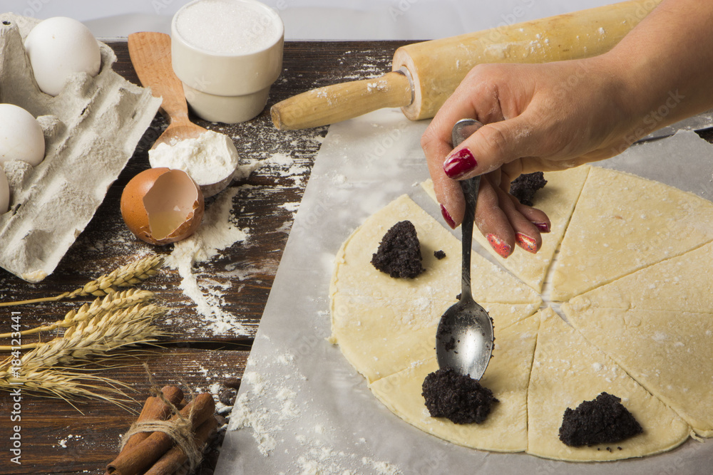 Fototapeta premium dough with close-up. man is preparing bread dough