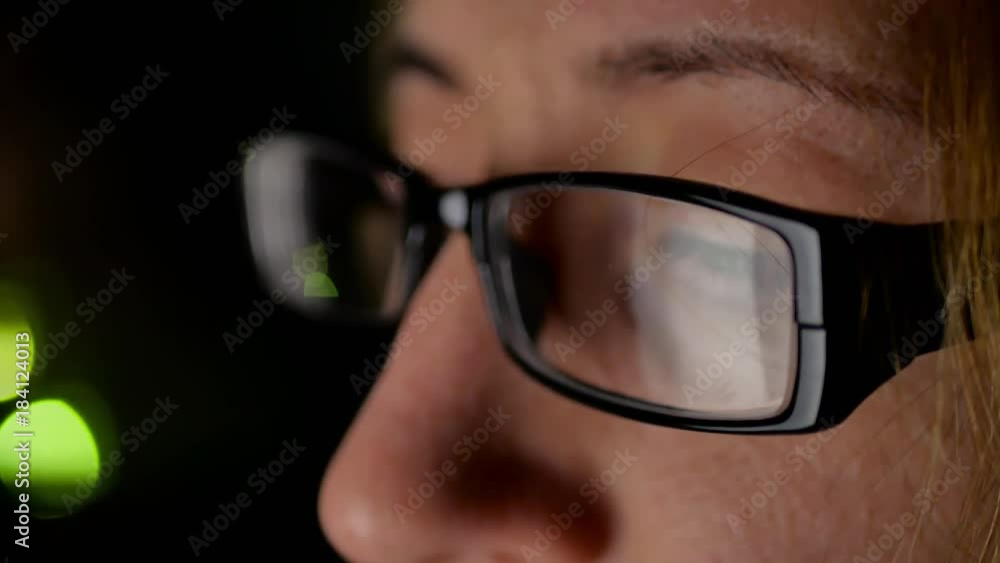Closeup shot of girl in glasses surfing internet at night. Closeup shot of girl in glasses surfing internet at night.