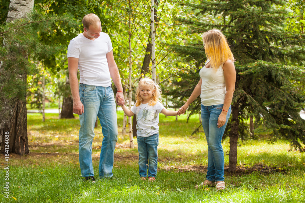 stylish young family in the same clothes for a walk stylish young family in the same clothes for a walk