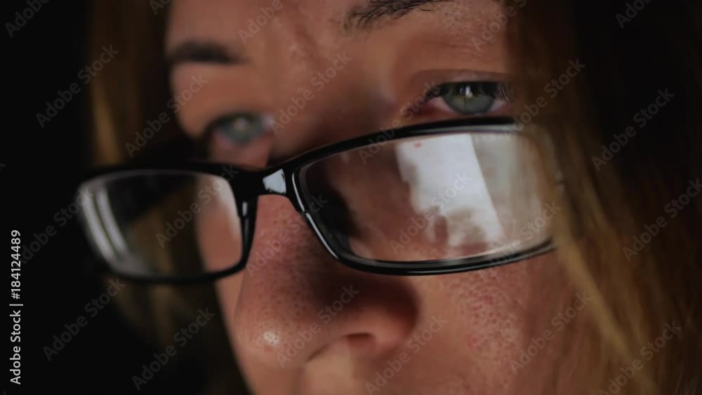 Closeup shot of girl in glasses surfing internet at night. Closeup shot of girl in glasses surfing internet at night.