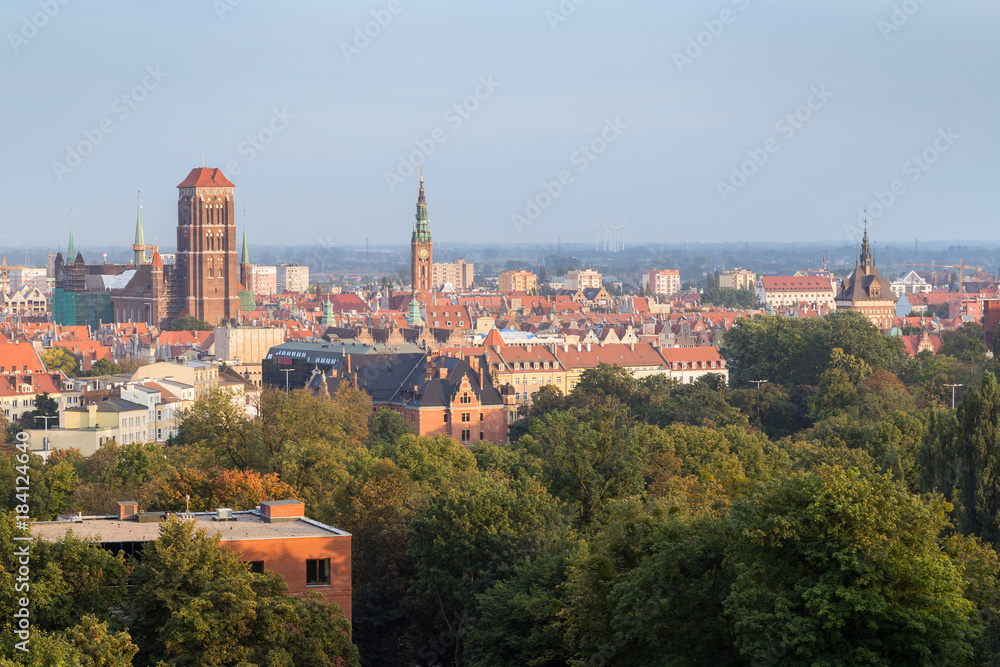 Buildings at the downtown, Main Town (Old Town) and beyond and St. Mary's Church in Gdansk, Poland, viewed from above on a sunny day in the summer.