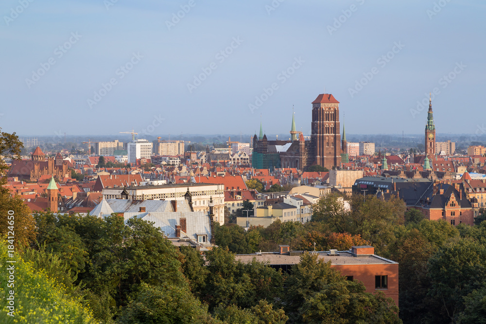 Buildings at the downtown, Main Town (Old Town) and beyond and St. Mary's Church in Gdansk, Poland, viewed from above on a sunny day in the summer.