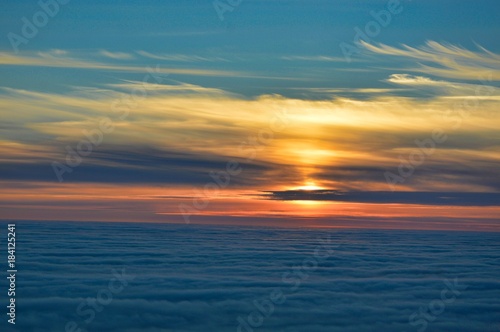 Colourful midnight sun  sunset  from Nordkapp  Norway  with spectacular sky and sea fog
