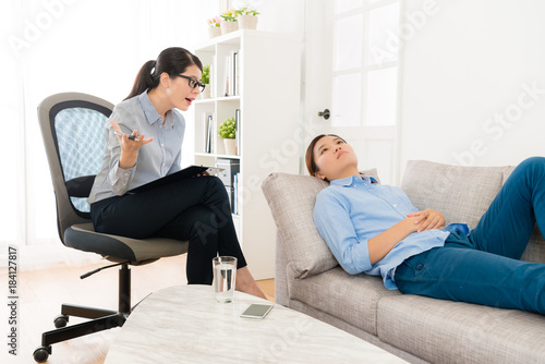 depression woman lying down on sofa relaxing