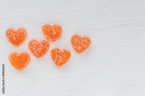 fruit jelly in the form of hearts on a white background