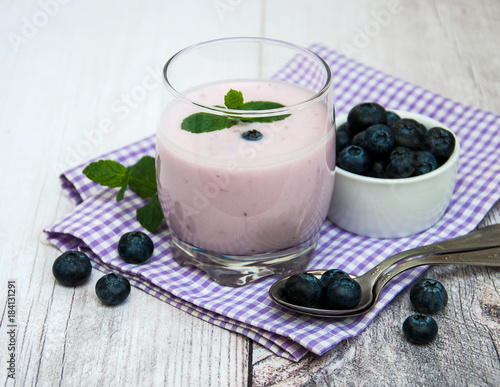 Glass with blueberry yogurt