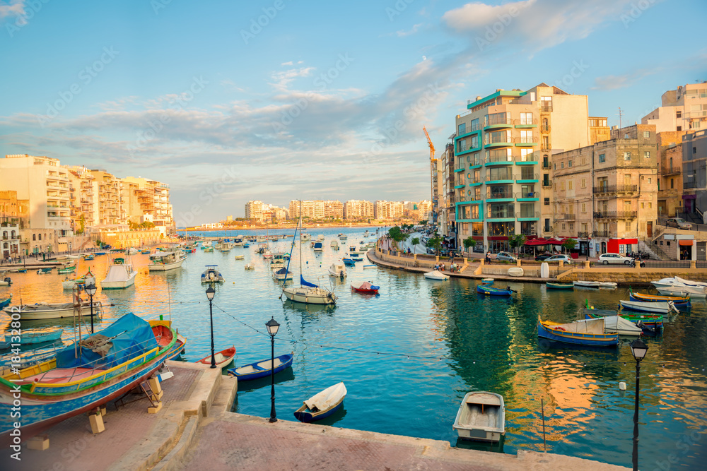 beautiful view of harbor with maltese yachts and boats in St. Julians to Sliema, Spinola Bay, Malta - obrazy, fototapety, plakaty 