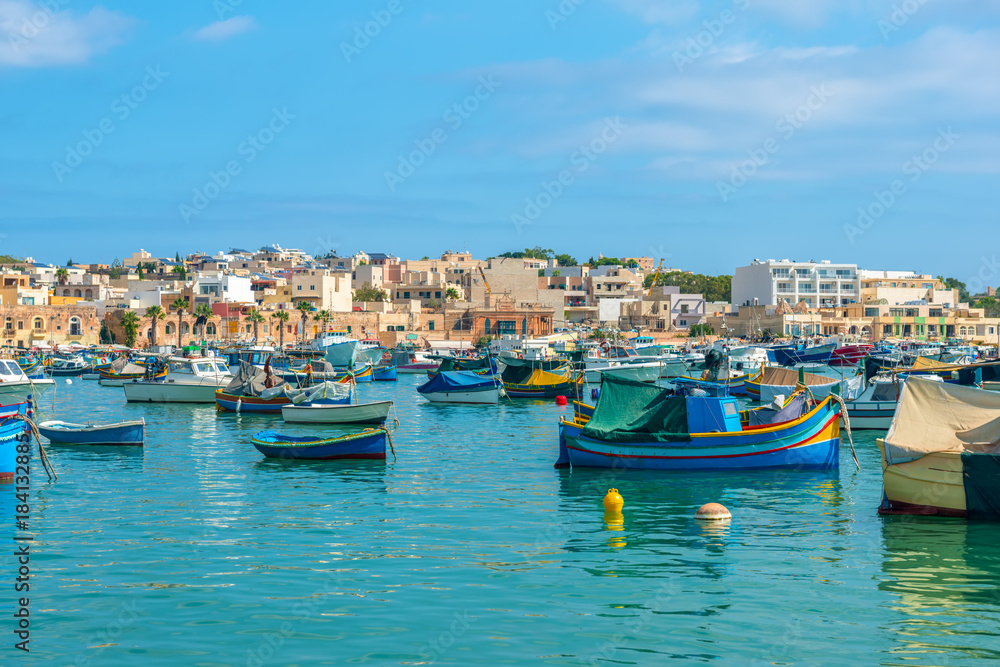 panoramic aerial skyline view to european harbor with village Marsaxlokk and traditional colorful Luzzu fishing boats, Malta panoramic aerial skyline view to european harbor with village Marsaxlokk and traditional colorful Luzzu fishing boats, Malta