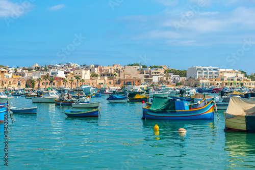panoramic aerial skyline view to european harbor with village Marsaxlokk and traditional colorful Luzzu fishing boats, Malta © Alisa