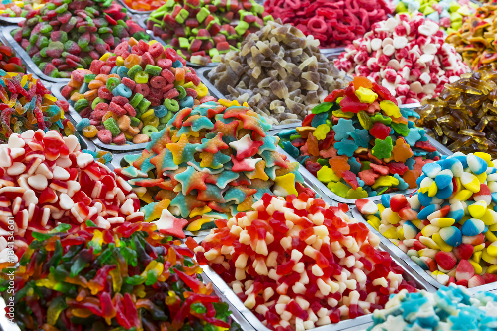 Assortment of jellied colored sweets as a product background