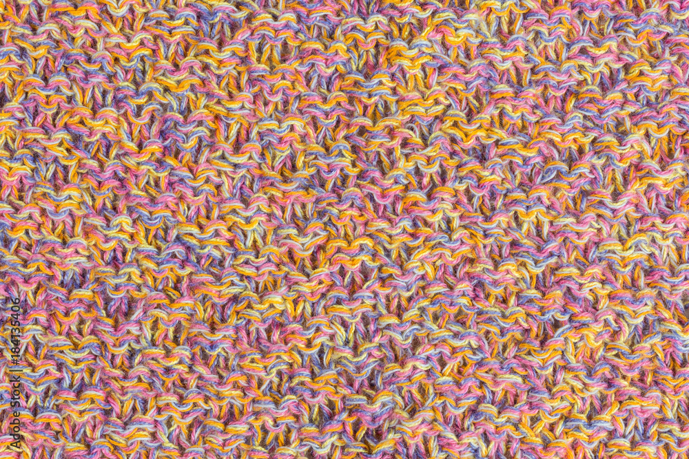 background of multicolored knitted fabric close-up background of multicolored knitted fabric close-up