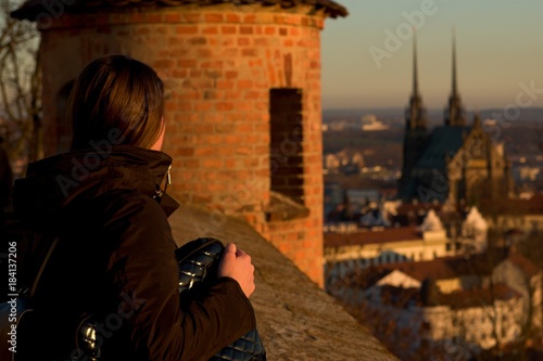 Dreamy look of the girl on St. Peter's and Paul's Cathedral, Brno, Czech republic