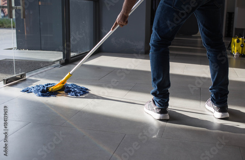 The man mop floor.