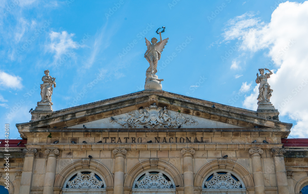 View of the gable roof of National Theater in Costa Rica downtown square with angle, beautiful blue sky and copy space for text.