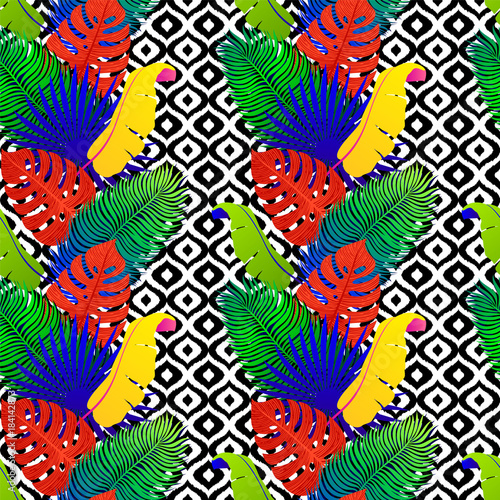 Tropical seamless pattern with exotic vivid leaves on black and white tribal ...