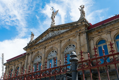 View of the gable roof of National Theater in Costa Rica downtown square with angle, beautiful blue sky and copy space for text. photo