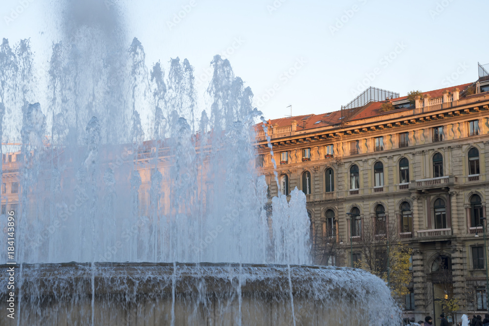 Fountain and ancient buildings in Milan, Italy