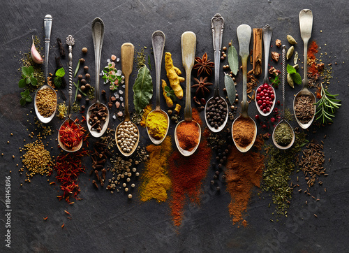 Herbs and spices on graphite background