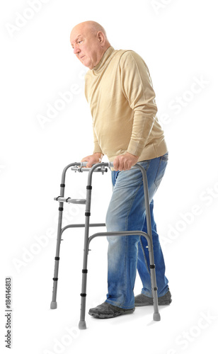 Elderly man with walking fr...