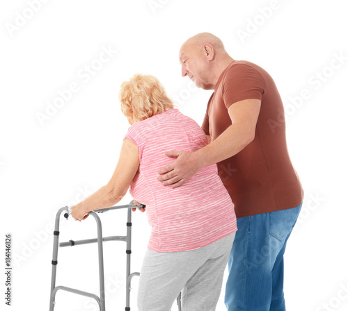 Elderly couple with walking...
