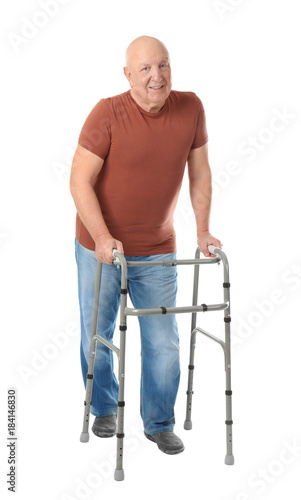 Elderly man with walking fr...