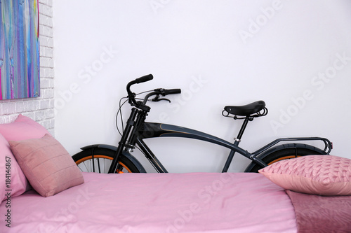 Black bicycle near wall in ...