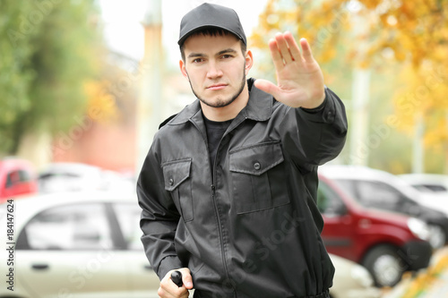 Male security guard on city...