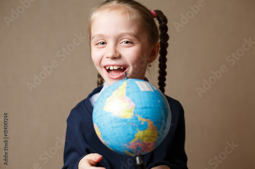 Cute kid with globe.