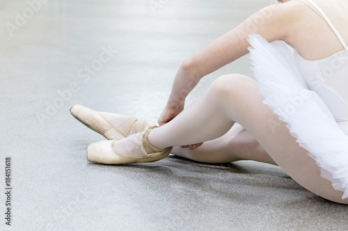 ballerina wears ballet shoes,close up, dolly shot
