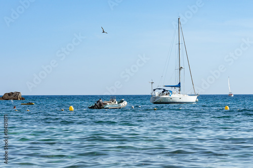 Sailboat at anchor near the beach