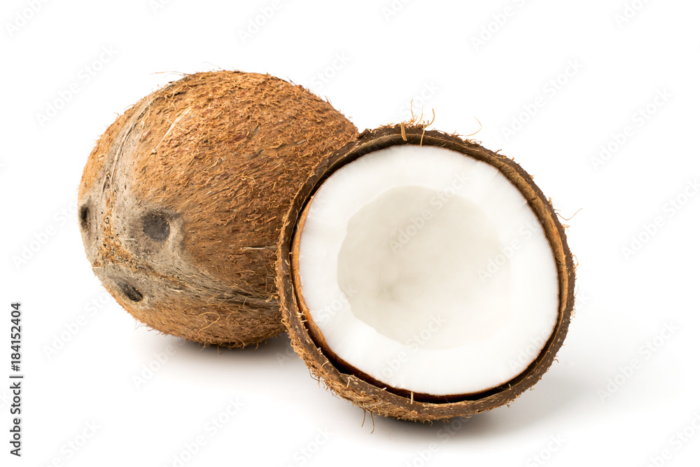 Ripe coconut and half on a white