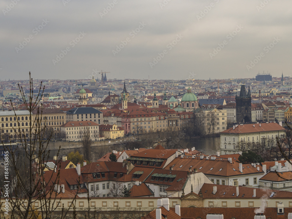 Prague city panorama View on old town with teen tower, charles bridge, saint nicholas church and vltava river bank from old castle steps way to prague castle