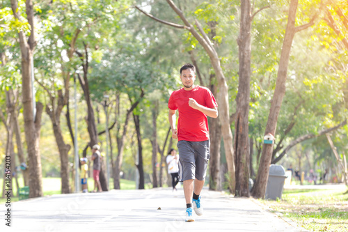 Fitness sport young man running in the park.Healthy concept
