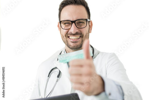 Handsome young doctor gestu...