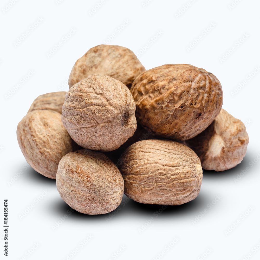 heap of nutmegs isolated on white background heap of nutmegs isolated on white background