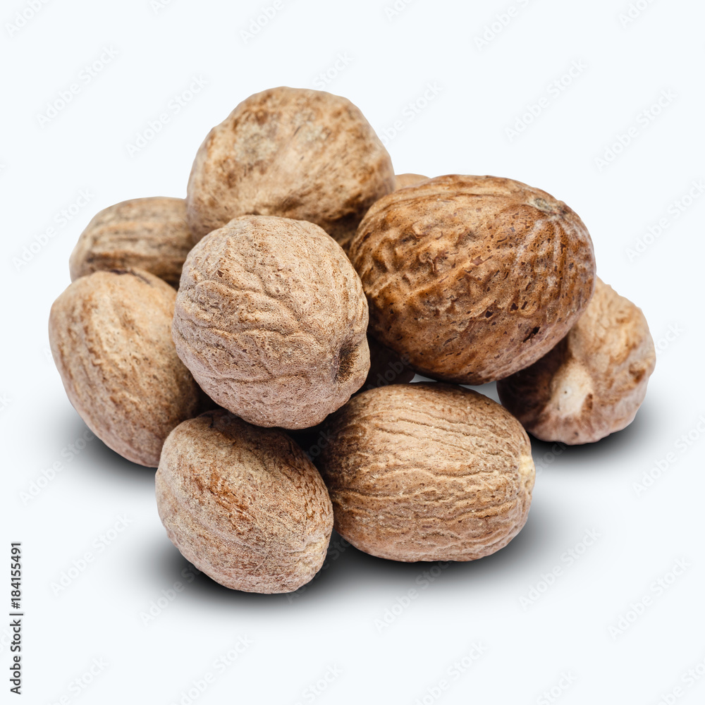 heap of nutmegs isolated on white background heap of nutmegs isolated on white background